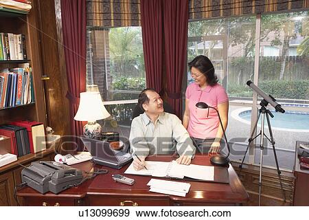 High angle view of a senior man talking to a mature woman View Large Photo Image Stock Photo - High angle view of a senior man talking to a mature woman. Fotosearch