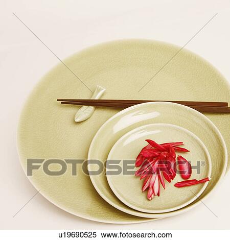 High angle view of flower petals and chopsticks in a plate View Large Photo Image Stock Photography - High angle view of flower petals and chopsticks in a plate. Fotosearch