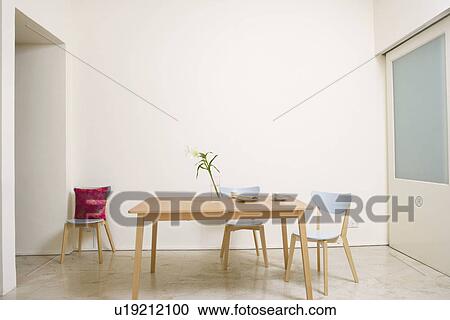 Stock Image - Table and chairs in a room. Fotosearch
