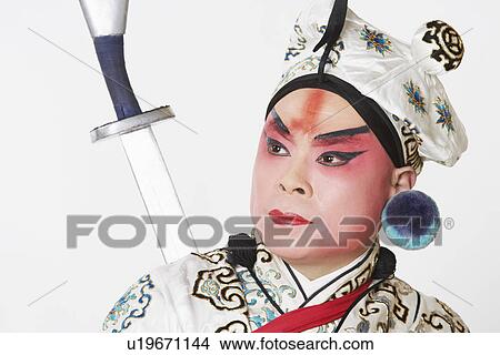 Picture - Close-up of a mature man wearing traditional clothing. Fotosearch