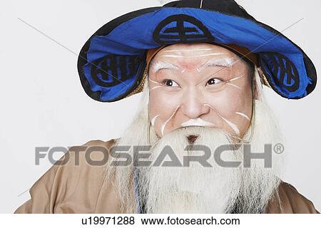 Close-up of a mid adult man looking away View Large Photo Image Stock Photo - Close-up of a mid adult man looking away. Fotosearch