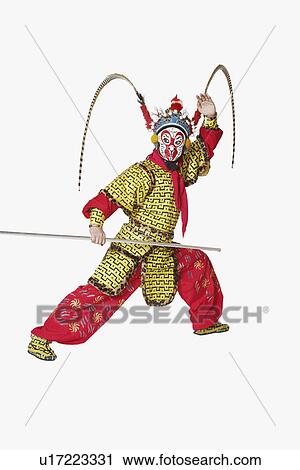 Male Chinese opera performer gesturing with a weapon View Large Photo Image Stock Image - Male Chinese opera performer gesturing with a weapon. Fotosearch