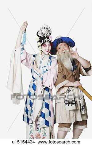 Picture - Mid adult man and a mature woman wearing traditional clothing. Fotosearch