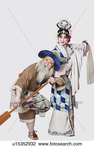 Mid adult man and a mature woman wearing traditional clothing View Large Photo Image Stock Image - Mid adult man and a mature woman wearing traditional clothing. Fotosearch