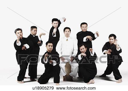 Stock Photo - Portrait of a group of people practicing martial arts. Fotosearch