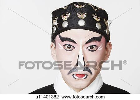 Stock Image - Portrait of a male Chinese opera performer making a face. Fotosearch