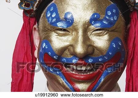 Stock Image - Portrait of a male Chinese opera performer smiling. Fotosearch