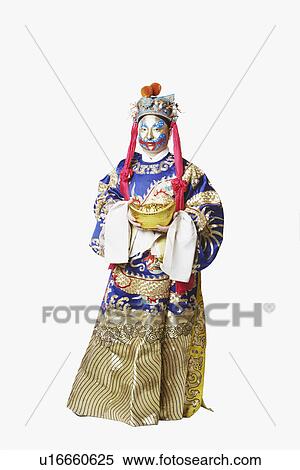 Stock Photography - Portrait of a male Chinese opera performer holding a bowl full of gold coins. Fotosearch