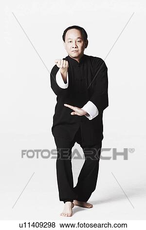 Stock Photo - Portrait of a mature man practicing martial arts. Fotosearch