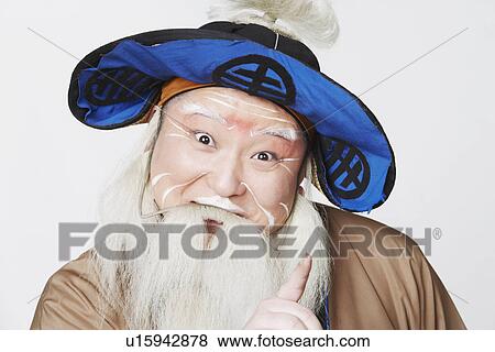 Portrait of a mid adult man pointing up View Large Photo Image Stock Photo - Portrait of a mid adult man pointing up. Fotosearch