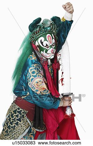 Side profile of a male Chinese opera performer holding a weapon View Large Photo Image Stock Image - Side profile of a male Chinese opera performer holding a weapon. Fotosearch