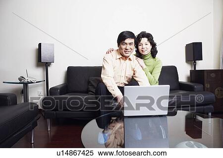 Stock Photography - Portrait of a mature couple smiling. Fotosearch