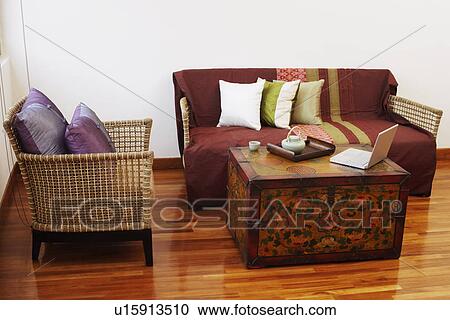 Teapot and a tea cup with a laptop on a trunk View Large Photo Image Stock Image - Teapot and a tea cup with a laptop on a trunk. Fotosearch