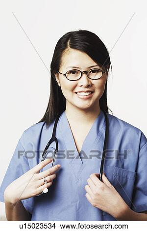 Portrait of a female doctor smiling View Large Photo Image Picture - Portrait of a female doctor smiling. Fotosearch