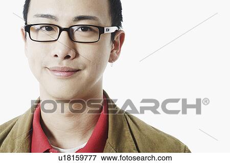 Stock Photo - Portrait of a young man grinning. Fotosearch
