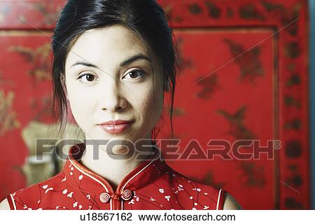 Stock Image - Portrait of a young woman grinning. Fotosearch