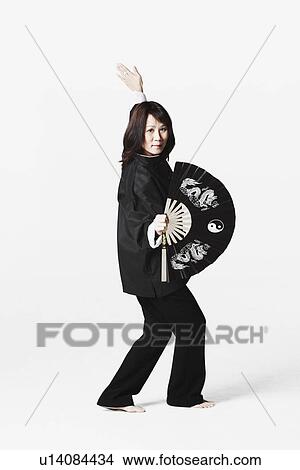 Picture - Portrait of a young woman practicing martial arts. Fotosearch