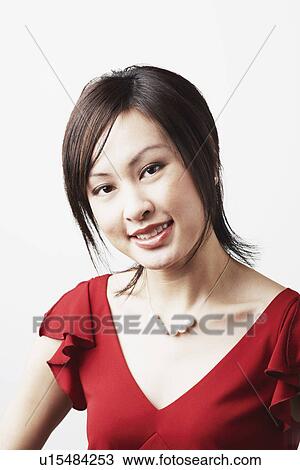 Portrait of a young woman smiling View Large Photo Image Stock Image - Portrait of a young woman smiling. Fotosearch