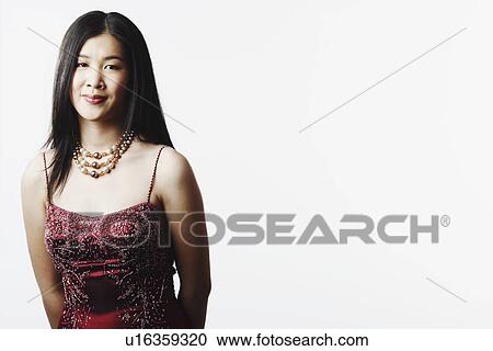 Stock Image - Portrait of a young woman smiling. Fotosearch