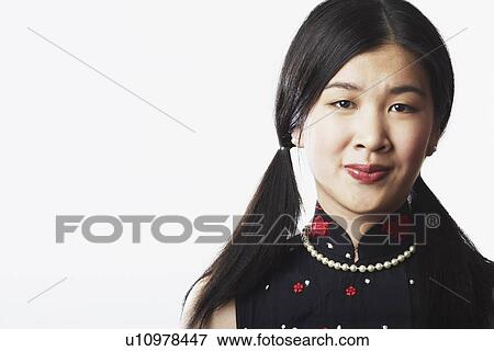 Stock Photo - Portrait of a young woman smiling. Fotosearch