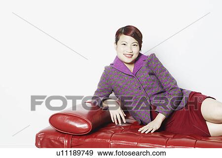 Stock Photo - Portrait of a young woman smiling. Fotosearch