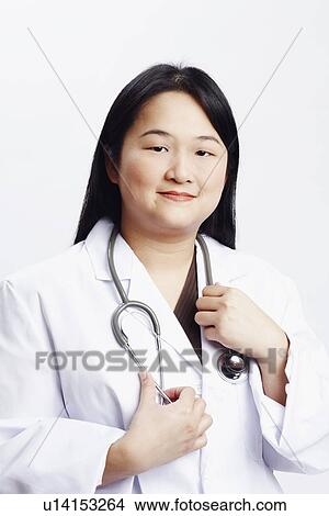 Picture - Portrait of a female doctor smiling. Fotosearch