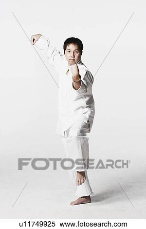Portrait of a mid adult man practicing martial arts View Large Photo Image Stock Photography - Portrait of a mid adult man practicing martial arts. Fotosearch