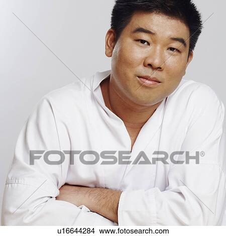 Picture - Portrait of a mid adult man wearing a karate uniform. Fotosearch