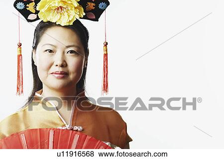 Portrait of a mid adult woman smiling View Large Photo Image Stock Photo - Portrait of a mid adult woman smiling. Fotosearch