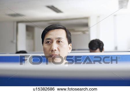 Stock Photograph - Close-up of a businessman thinking. Fotosearch