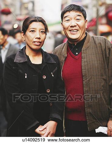 Stock Photo - Portrait of a mature couple standing together. Fotosearch