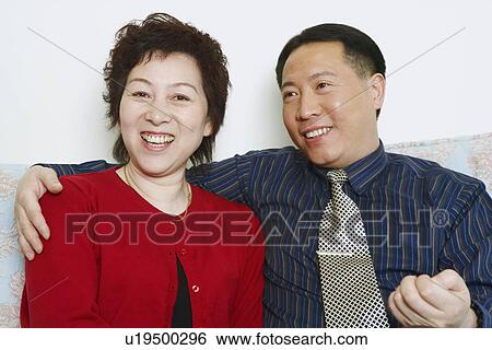 Portrait of a mature woman and a mature man smiling View Large Photo Image Stock Photograph - Portrait of a mature woman and a mature man smiling. Fotosearch