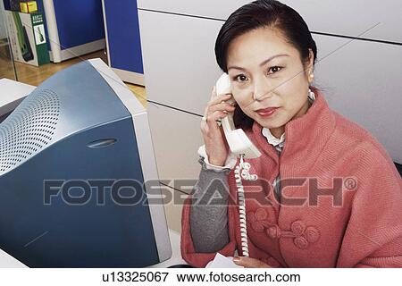 Portrait of a mature woman talking on the telephone View Large Photo Image Stock Photo - Portrait of a mature woman talking on the telephone. Fotosearch