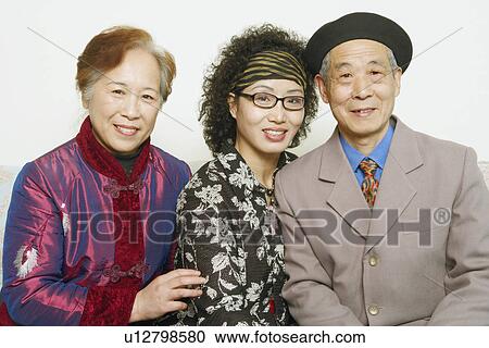 Portrait of a senior man sitting with two mature women View Large Photo Image Stock Image - Portrait of a senior man sitting with two mature women. Fotosearch