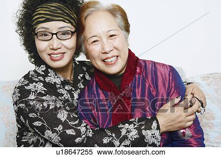 Stock Photography - Portrait of two mature women smiling. Fotosearch