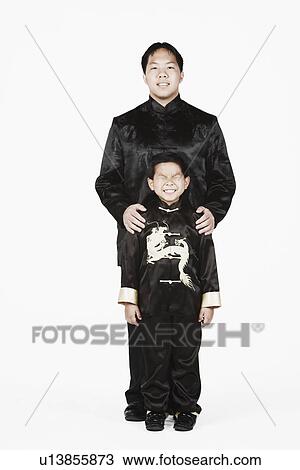 Portrait of a father and his son smiling together View Large Photo Image Stock Image - Portrait of a father and his son smiling together. Fotosearch