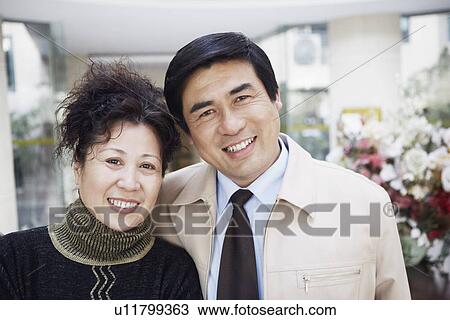 Stock Image - Portrait of a mature couple smiling. Fotosearch