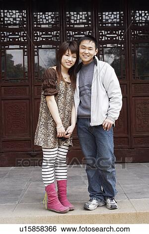Portrait of a young couple smiling View Large Photo Image Stock Photograph - Portrait of a young couple smiling. Fotosearch