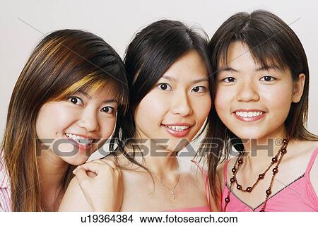 Picture - Portrait of three young women smiling. Fotosearch
