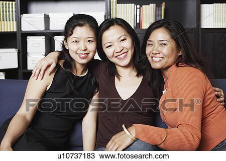 Portrait of three young women smiling View Large Photo Image Stock Image - Portrait of three young women smiling. Fotosearch