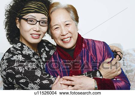 Portrait of two mature women smiling View Large Photo Image Picture - Portrait of two mature women smiling. Fotosearch