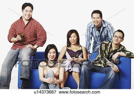 Portrait of two young women and three young men smiling View Large Photo Image Stock Photo - Portrait of two young women and three young men smiling. Fotosearch