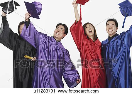 Two male graduates and two female graduates holding their mortar boards View Large Photo Image Stock Image - Two male graduates and two female graduates holding their mortar boards. Fotosearch