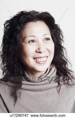 Close-up of a businesswoman smiling View Large Photo Image Stock Photo - Close-up of a businesswoman smiling. Fotosearch