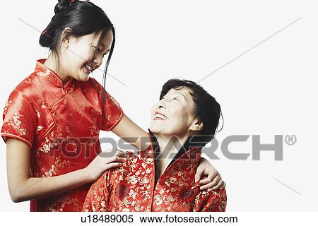 Close-up of a grandmother with her granddaughter View Large Photo Image Stock Photography - Close-up of a grandmother with her granddaughter. Fotosearch