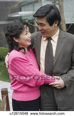 Mature couple embracing each other View Large Photo Image Stock Photo - Mature couple embracing each other. Fotosearch