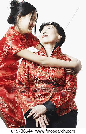 Picture - Portrait of a granddaughter hugging her grandmother. Fotosearch