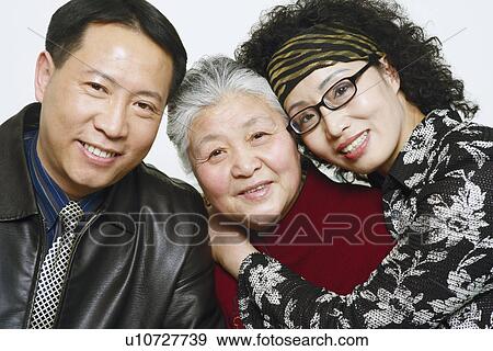 Stock Photo - Portrait of a mature couple with a senior woman. Fotosearch