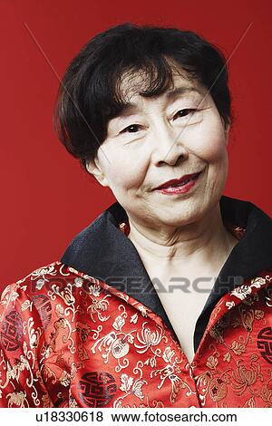 Portrait of a mature woman smiling View Large Photo Image Stock Photo - Portrait of a mature woman smiling. Fotosearch