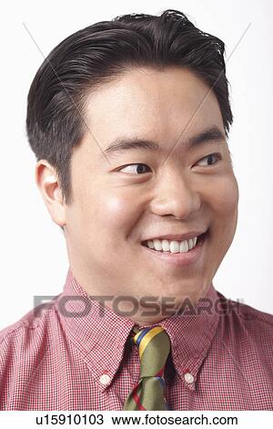 Close-up of a businessman smiling View Large Photo Image Stock Image - Close-up of a businessman smiling. Fotosearch